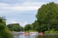 Unidentified people drafting in the river Vantaa at the Kaljakellunta Beer Floating festival in Helsinki, Finland Royalty Free Stock Photo